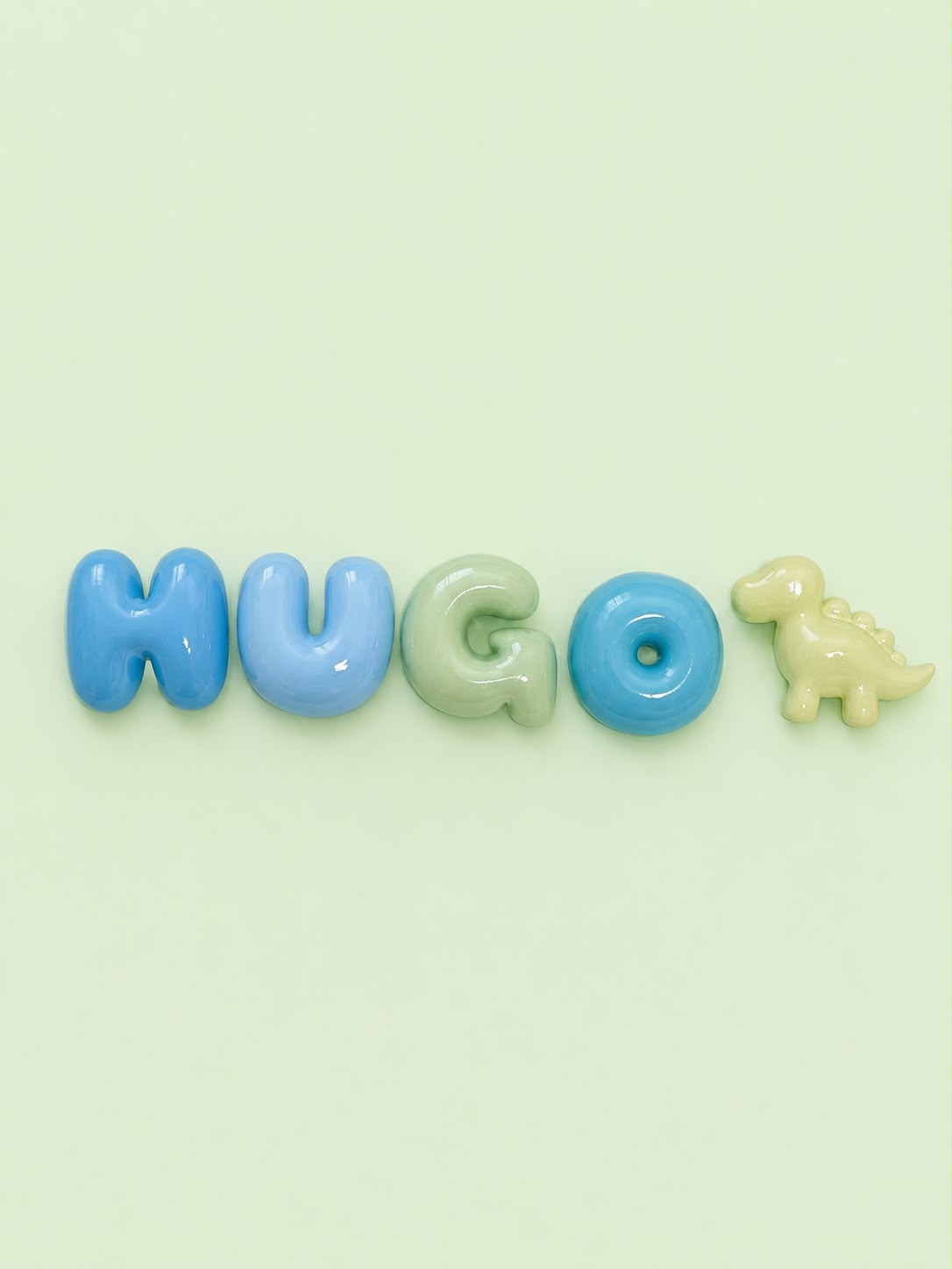 Nombre Hugo en letras bubble azules y verde con un dinosaurio lima